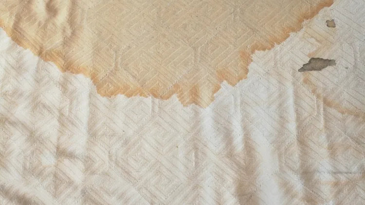 What Causes Yellow Stains On a Mattress Header